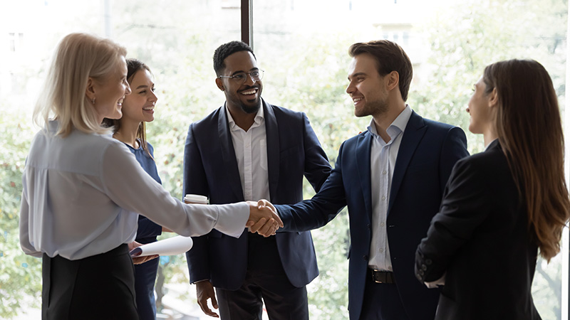 Diverse businesspeople handshake getting acquainted in office